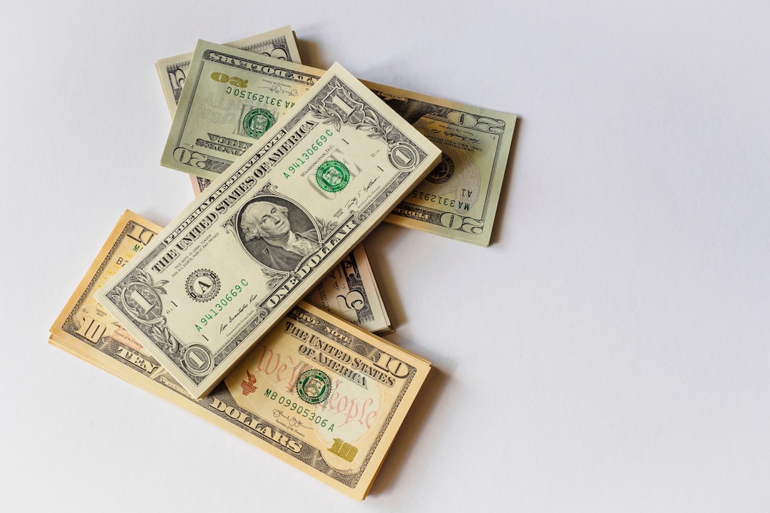 A pile of U.S. dollar bills symbolizing potential earnings from top affiliate marketing platforms to boost revenue.